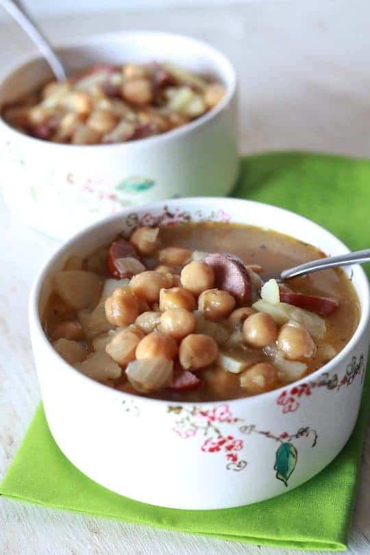 Spanish Bean Soup | Savory soup of garbanzo beans, potatoes and spicy sausage in a chicken broth. | TheNoshery.com - @TheNoshery