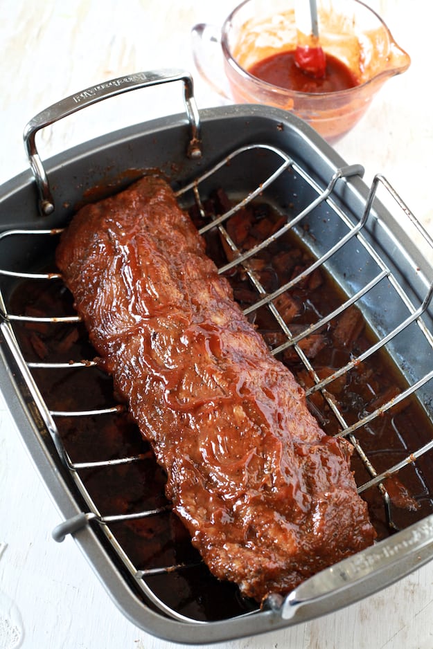 Spicy BBQ Oven Smoked Ribs | Hot and spicy baby back ribs smoked in the oven. Perfect for game day! | TheNoshery.com - @thenoshery