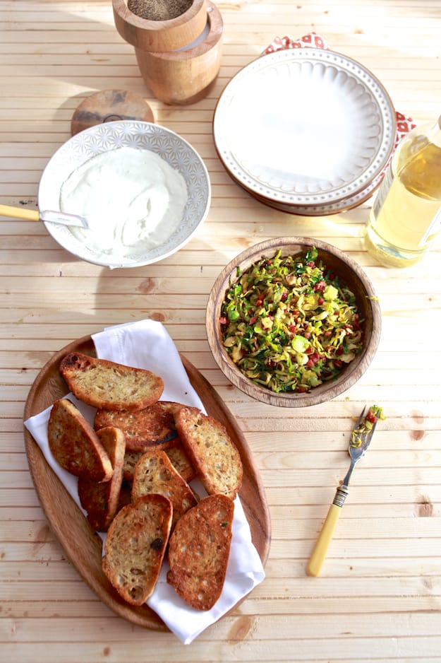 Brussels Sprouts and Ricotta Toast | Hearty toast topped with whipped ricotta cheese, shaved brussels sprouts and pancetta. | TheNoshery.com - @thenoshery