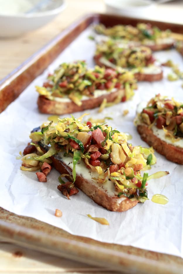 Brussels Sprouts and Ricotta Toast | Hearty toast topped with whipped ricotta cheese, shaved brussels sprouts and pancetta. | TheNoshery.com - @thenoshery