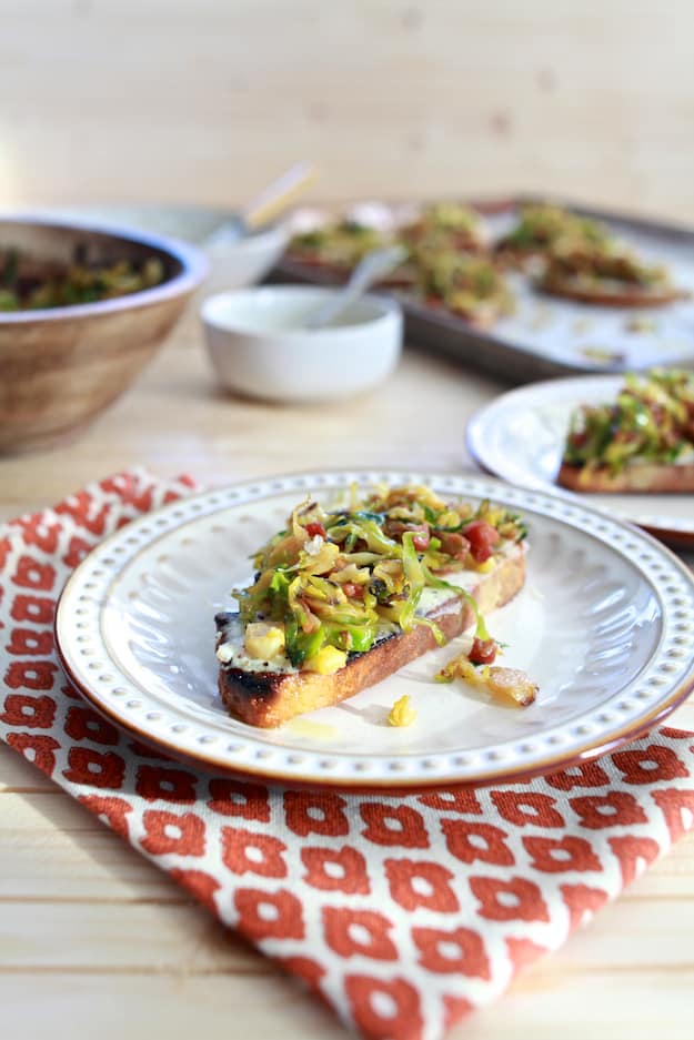 Brussels Sprouts and Ricotta Toast | Hearty toast topped with whipped ricotta cheese, shaved brussels sprouts and pancetta. | TheNoshery.com - @thenoshery