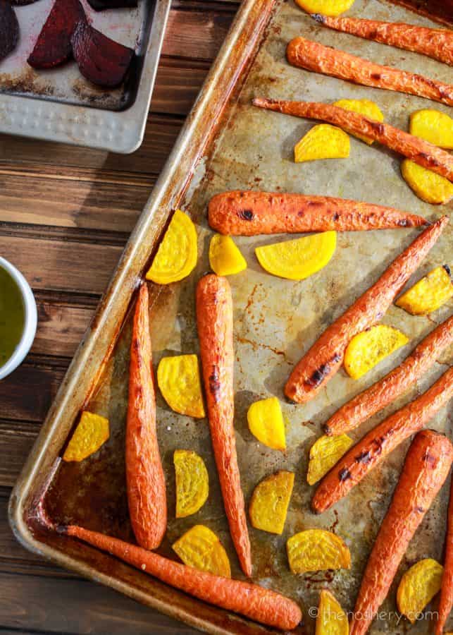 Roasted Beets and Carrots Salad with Burrata | A sheet pan with roasted carrots and sliced gold beets. | The Noshery