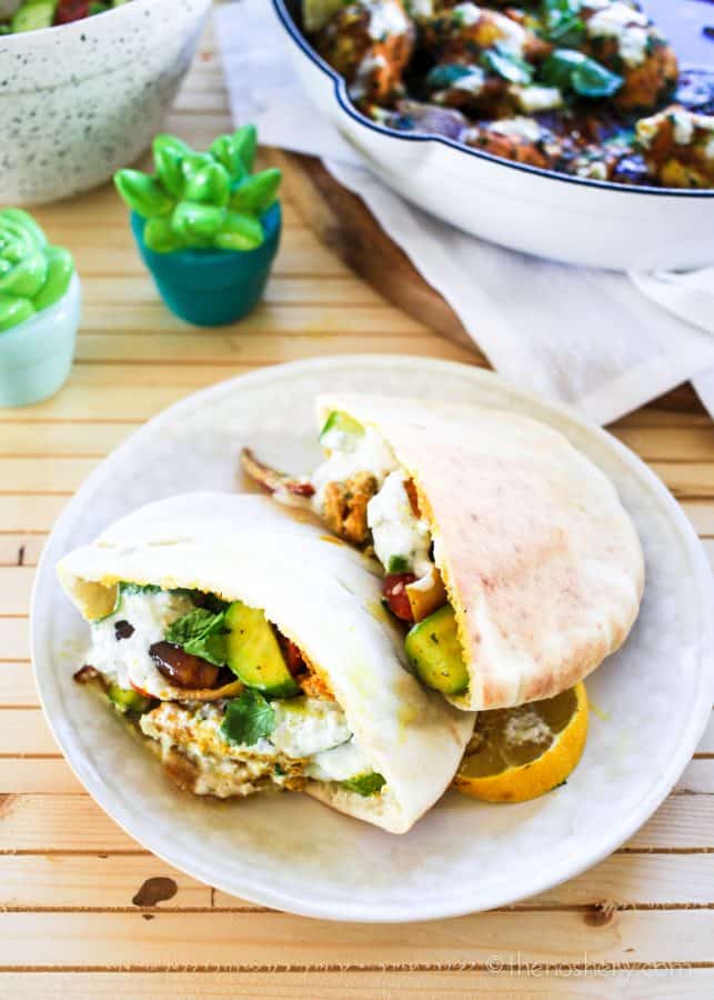 Oven Roasted Chicken Shawarma in pita pockets on a plate | | The Noshery