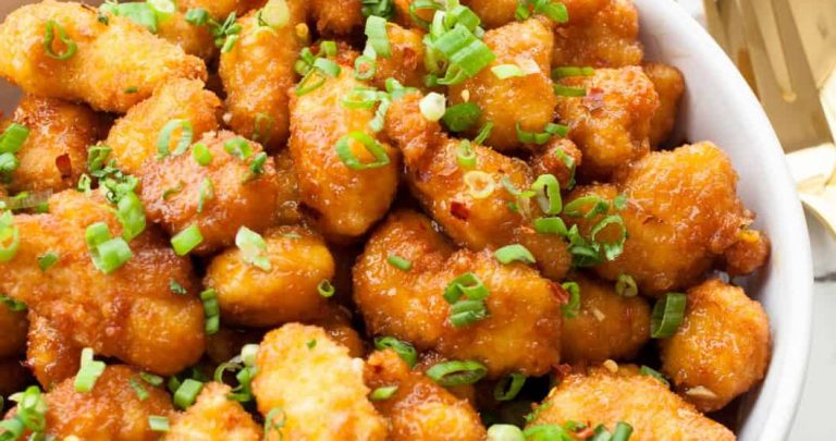 Orange Chicken That's Better Than Takeout | Orange chicken with a light crispy breading & a sweet and tangy sauce. There is no lack of orange flavor, & the red pepper flakes give it a touch of heat. | The Noshery