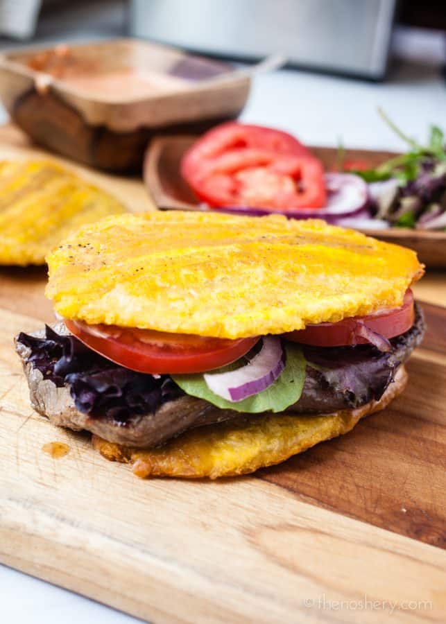 Jibarito (Plantain and Steak Sandwich) | The incredible plantain strikes again! Delicious and tender steak sandwich made with crispy fried plantains as bread. Satisfying and even gluten free. | The Noshery