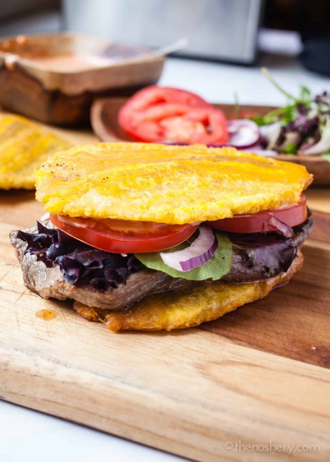 Jibarito (Plantain and Steak Sandwich) | The incredible plantain strikes again! Delicious and tender steak sandwich made with crispy fried plantains as bread. Satisfying and even gluten free. | The Noshery
