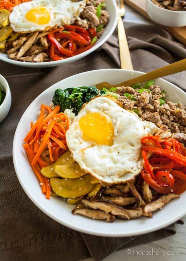 Overhead shots of Ground Pork Bulgogi + Cauliflower Rice | Sautéed vegetables, with a fried egg, and ground pork