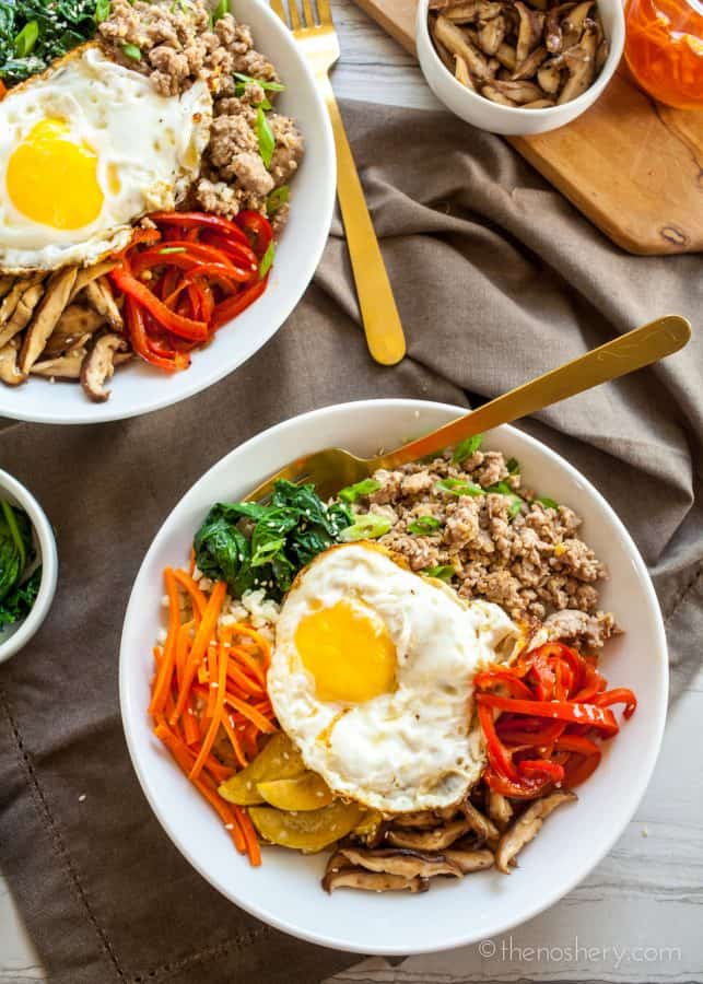 Overhead shots of Ground Pork Bulgogi + Cauliflower Rice | Sautéed vegetables, with a fried egg, and ground pork