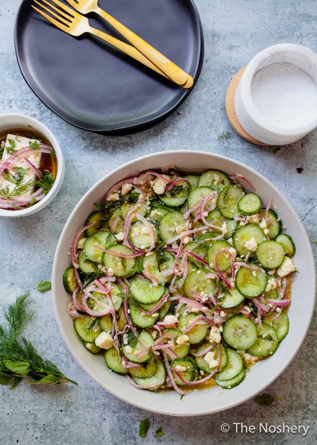 Cucumber Salad with Feta Cheese |This refreshing cucumber salad with feta cheese marinated in tangy vinegar and fresh herbs makes a tasty and refreshing side dish. Perfect for summer!| The Noshery